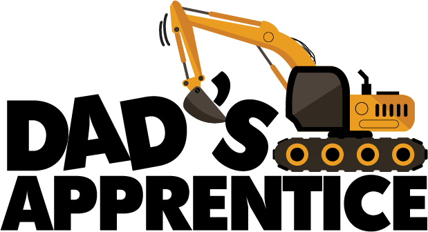 Dad's Apprentice design: Huge black block letters reading "DAD'S APPRENTICE" with a bright orange excavator perched on top of the word DAD'S, its bucket arm reaching up and over the lettering.